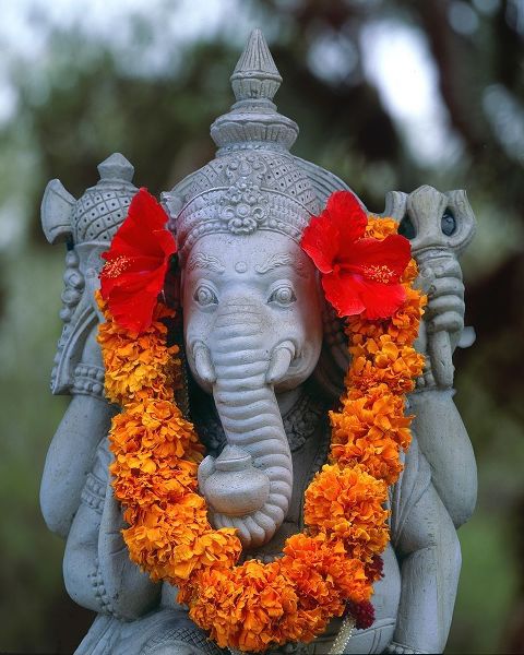 Indonesia-Bali Garland on statue of the Hindu elephant god-Ganesh